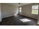 Bright bedroom with hardwood floors and natural light from multiple windows at 17370 Cape Horn Blvd, Punta Gorda, FL 33955