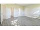 Bedroom featuring light gray vinyl floors and neutral walls with ensuite bathroom and closet at 17370 Cape Horn Blvd, Punta Gorda, FL 33955