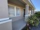 Inviting front porch featuring a neutral color palette and manicured landscaping at 17370 Cape Horn Blvd, Punta Gorda, FL 33955