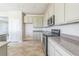 Modern kitchen with granite counters, stainless steel appliances, and ample cabinet space at 17370 Cape Horn Blvd, Punta Gorda, FL 33955