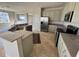 Open kitchen layout with granite countertops, stainless appliances, and tile floors at 17370 Cape Horn Blvd, Punta Gorda, FL 33955