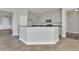 Kitchen features tile floors, neutral paint, stainless appliances, and stone counters at 17370 Cape Horn Blvd, Punta Gorda, FL 33955