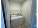 Convenient laundry room equipped with a washer and dryer, and wire shelving at 17370 Cape Horn Blvd, Punta Gorda, FL 33955