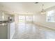 Bright living room features tile floors, neutral paint, and lots of windows at 17370 Cape Horn Blvd, Punta Gorda, FL 33955