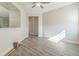 Bright living room features modern gray flooring, neutral walls, and ceiling fan at 17370 Cape Horn Blvd, Punta Gorda, FL 33955