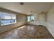 This living room features neutral walls, two windows, and a tiled floor at 17370 Cape Horn Blvd, Punta Gorda, FL 33955
