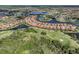 High altitude aerial view showcasing the community, golf course and lakes at 174 Treviso Ct, North Venice, FL 34275