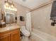Well-maintained bathroom with a shower-tub combination, single sink vanity, and ample lighting at 174 Treviso Ct, North Venice, FL 34275