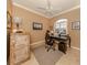 Inviting home office space with a ceiling fan, natural light, and comfortable decor at 174 Treviso Ct, North Venice, FL 34275