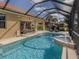 Relaxing pool area with lounge chairs, spa, and outdoor living space perfect for entertaining at 174 Treviso Ct, North Venice, FL 34275