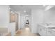Bright bathroom featuring a double sink vanity with white cabinets, tiled flooring and walk-in shower with a glass door at 17449 Luminous Ave, Venice, FL 34293