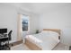 Bright bedroom with a simple aesthetic featuring natural light and neutral colors at 17449 Luminous Ave, Venice, FL 34293