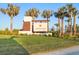 Community sign for Lakespur at Wellen Park, surrounded by manicured lawns and palm trees at 17449 Luminous Ave, Venice, FL 34293