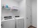 Clean laundry room with modern washer and dryer, and ample storage space at 17449 Luminous Ave, Venice, FL 34293