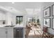 Open-concept living space featuring modern furnishings, recessed lighting, and sliding glass doors to the backyard at 17449 Luminous Ave, Venice, FL 34293