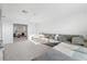Spacious living room with plush sectional couch near doorway at 17449 Luminous Ave, Venice, FL 34293