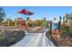 Community playground featuring colorful equipment for children to enjoy, including slides, swings, and climbing structures at 17449 Luminous Ave, Venice, FL 34293