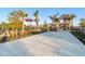 Community playground near a pergola with picnic tables, providing recreation and relaxation for all at 17449 Luminous Ave, Venice, FL 34293
