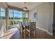 Bright dining room with golf course view through sliding doors for indoor/outdoor living at 1783 San Silvestro Drive, Venice, FL 34285