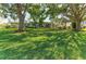 Large backyard and lush lawn showcase the waterfront home at 1837 Upper Cove Ter, Sarasota, FL 34231