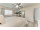 Bedroom features a TV, ceiling fan, and mirrored closet doors at 1837 Upper Cove Ter, Sarasota, FL 34231
