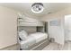 Bedroom featuring a gray bunk bed and ceiling fan at 1837 Upper Cove Ter, Sarasota, FL 34231