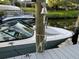 Close-up of a boat at a private dock, highlighting boating lifestyle and waterfront access at 1837 Upper Cove Ter, Sarasota, FL 34231