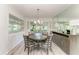 Elegant dining room with a round table and chairs under a chandelier at 1837 Upper Cove Ter, Sarasota, FL 34231