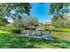 Private boat dock featuring chairs, grill, and an umbrella perfect for outdoor entertainment and waterfront living at 1837 Upper Cove Ter, Sarasota, FL 34231