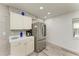 Stainless steel refrigerator in a well-lit kitchen with neutral-toned decor at 1837 Upper Cove Ter, Sarasota, FL 34231