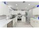 Well-lit kitchen with stainless steel appliances, ample countertop space, and neutral tones at 1837 Upper Cove Ter, Sarasota, FL 34231