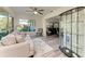 Comfortable living space with ample seating, a decorative display case, and a view outside at 1837 Upper Cove Ter, Sarasota, FL 34231