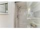 Updated shower featuring glass door, showerhead, and a built in soap niche at 1837 Upper Cove Ter, Sarasota, FL 34231