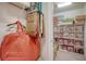 Storage closet with ample shelving, carpet flooring and hanging storage at 19651 Quisto St, Venice, FL 34293