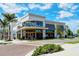 Inviting Foxtail Coffee Co. with large windows, outdoor seating, and lush landscaping enhance the customer experience at 19651 Quisto St, Venice, FL 34293