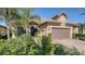 Charming single-story home with lush landscaping and a well-maintained paver driveway, creating inviting curb appeal at 19651 Quisto St, Venice, FL 34293