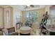 Bright office featuring a large window with plantation shutters, ample desk space, and neutral paint color at 19651 Quisto St, Venice, FL 34293