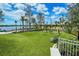 Community playground includes swings and seating with a view of the lake enhancing Gathering enjoyment at 19651 Quisto St, Venice, FL 34293