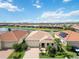 Beautiful home with a brick driveway, well-manicured landscaping, and solar panels on the roof at 20389 Minuet Pl, Venice, FL 34293