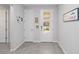 Bright foyer with tile flooring, white doors, and decorative wall accents at 20389 Minuet Pl, Venice, FL 34293