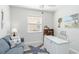 Bright office featuring a desk, comfortable seating and a star fish rug at 20389 Minuet Pl, Venice, FL 34293
