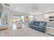 Open-concept living room with stylish furniture and a view of the outdoor patio at 20389 Minuet Pl, Venice, FL 34293