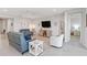 Open living room with comfortable seating, stylish decor, and a view of the backyard at 20389 Minuet Pl, Venice, FL 34293