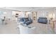 Bright, open living space with modern furnishings, a kitchen island, and stylish décor at 20389 Minuet Pl, Venice, FL 34293