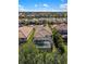 Aerial view of a home featuring a screened-in backyard pool and well-manicured landscaping at 2042 Mesic Hammock Way, Venice, FL 34292