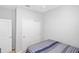 Neutral bedroom with a closet, ceiling fan and comfortable sleeping space at 2042 Mesic Hammock Way, Venice, FL 34292