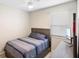 Simply styled bedroom with a ceiling fan and a comfortable bed at 2042 Mesic Hammock Way, Venice, FL 34292