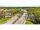 Beautiful entrance to Stoneybrook at Venice featuring lush landscaping and elegant signage at 2042 Mesic Hammock Way, Venice, FL 34292