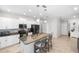 Kitchen featuring granite counters, white cabinetry and stainless steel appliances at 2042 Mesic Hammock Way, Venice, FL 34292