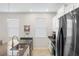 Kitchen with stainless steel appliances, granite countertops, and a view of the sink and window at 2042 Mesic Hammock Way, Venice, FL 34292
